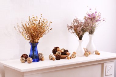 Still life of dried flowers on white wall background clipart