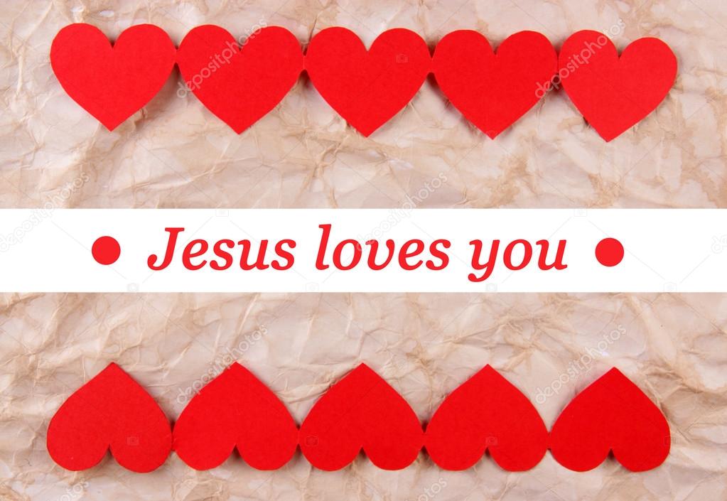 Jesus loves you text in frame on craft paper background
