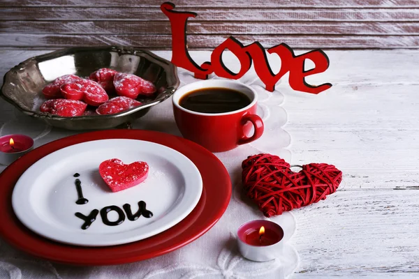 Cookie in form of heart on plate with inscription I Love You on color wooden table background — Stock Photo, Image