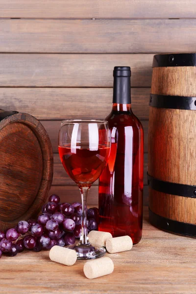 Red wine on table on wooden background — Stock Photo, Image
