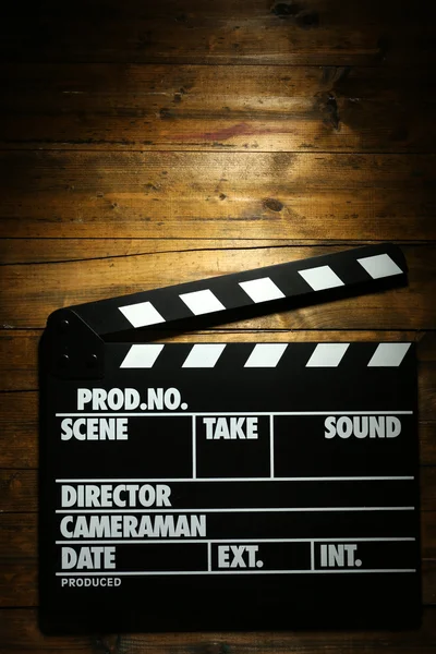 Movie clapper on wooden background — Stock Photo, Image