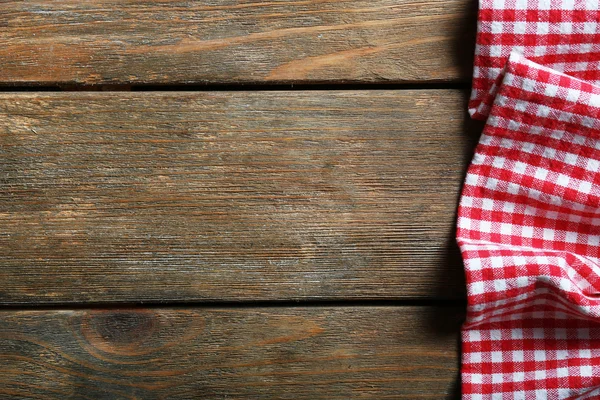 Servilleta sobre mesa de madera — Foto de Stock