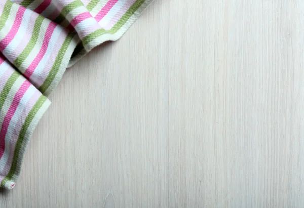 Napkin on wooden table — Stock Photo, Image