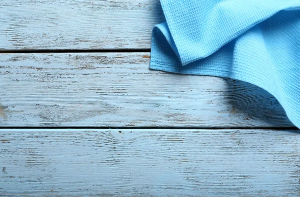 Napkin on wooden table — Stock Photo, Image