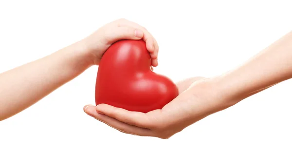 Heart in child and mother hands — Stock Photo, Image