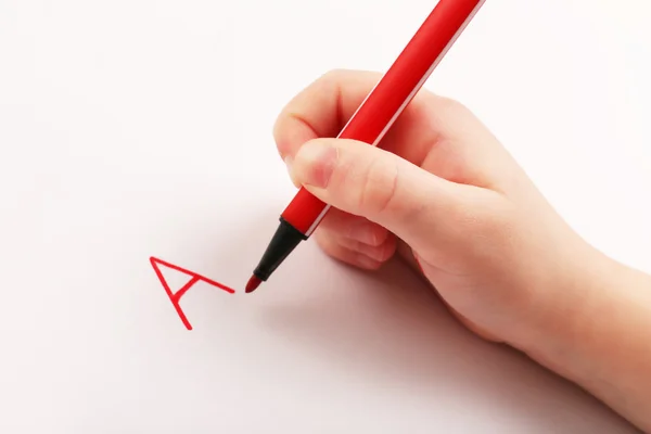 Child hand writing letters — Stock Photo, Image