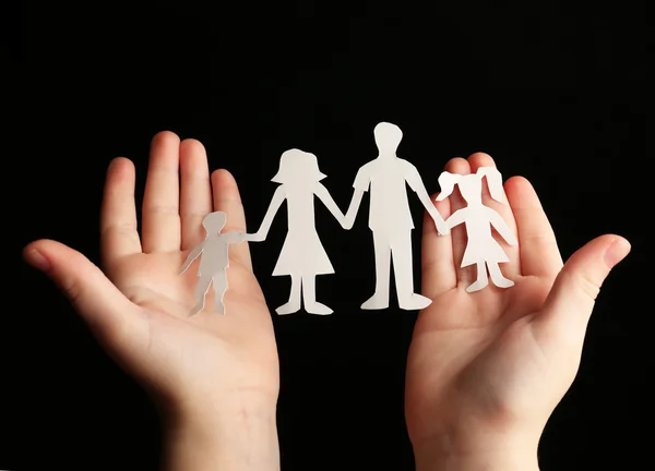 Paper family in child hands — Stock Photo, Image