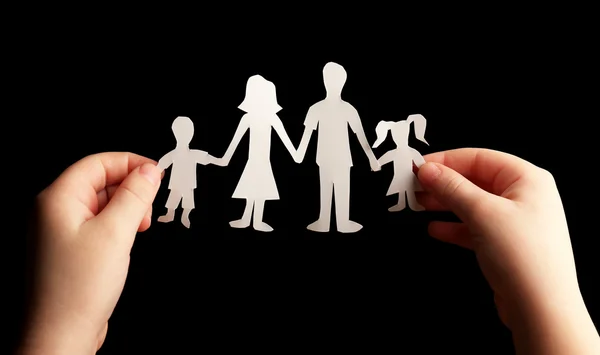 Paper family in child hands — Stock Photo, Image