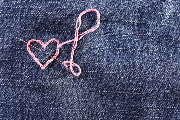 Jeans fabric with heart — Stock Photo, Image