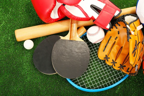 Sports equipment on grass background — Stock Photo, Image