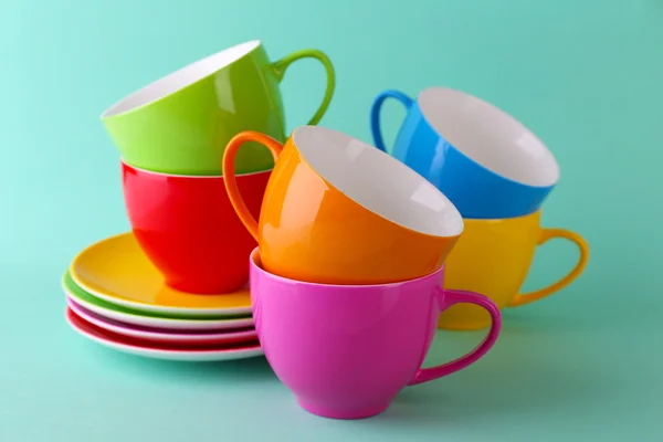 Colorful cups and saucers — Stock Photo, Image