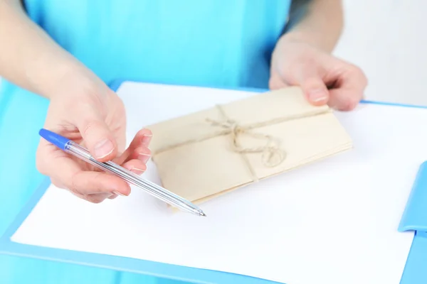 Courier with letter close-up — Stock Photo, Image