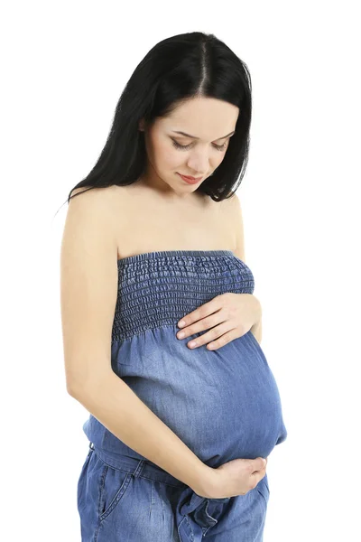 Mooie jonge zwangere vrouw aan haar buik op wit wordt geïsoleerd te raken — Stockfoto