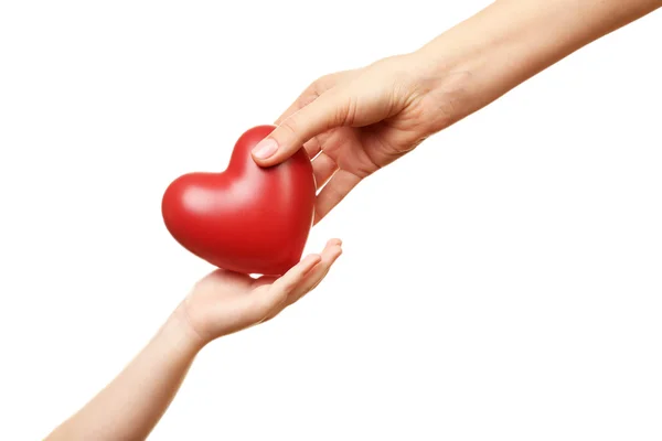 Heart in child and mother hands isolated on white — Stock Photo, Image