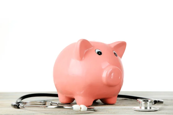 Piggy bank with stethoscope — Stock Photo, Image