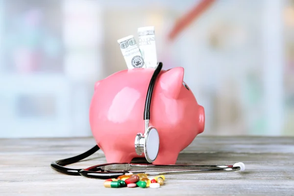 Piggy bank with stethoscope — Stock Photo, Image