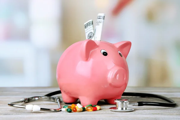 Piggy bank with stethoscope — Stock Photo, Image