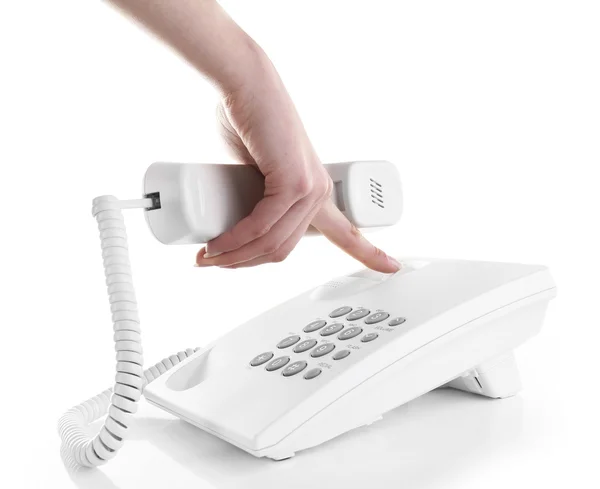 Female hand holding phone receiver — Stock Photo, Image