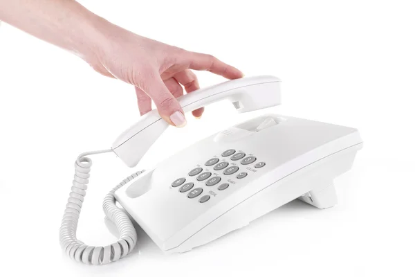 Weibliche Hand hält Telefonhörer — Stockfoto