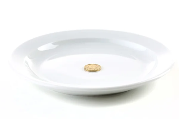 Coin on plate — Stock Photo, Image