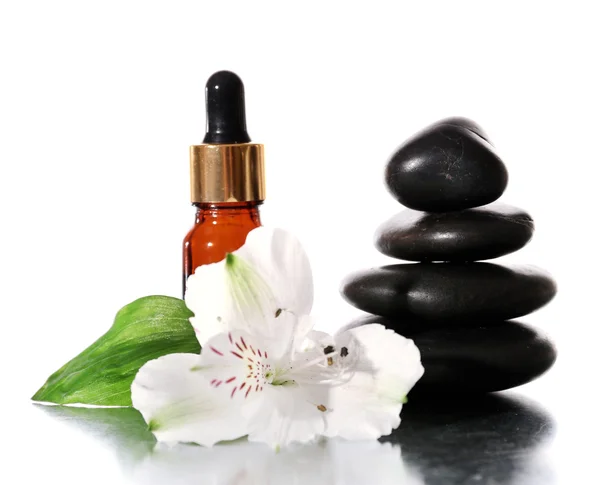 Spa stones with aromatic oils and flower isolated on white — Stock Photo, Image