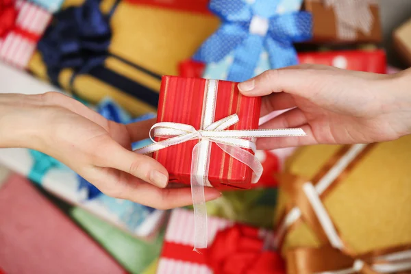 Female hands holding gift — Stock Photo, Image