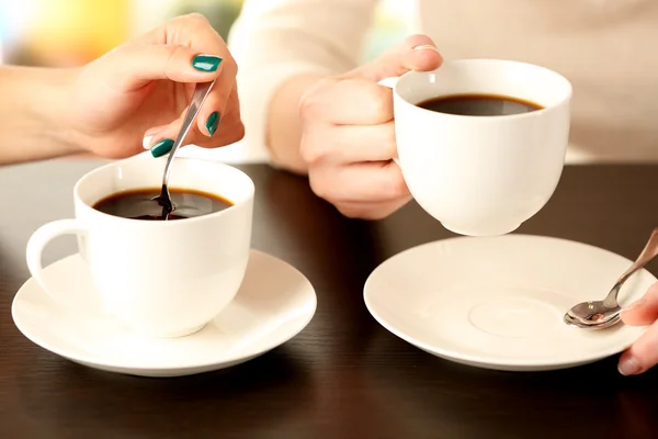 Two women with cups of coffee — Stock Photo, Image