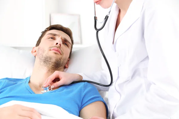 Doctor examining bronchi of patient close up — Stock Photo, Image