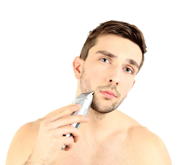 Bonito jovem barbeando sua barba isolada em branco — Fotografia de Stock