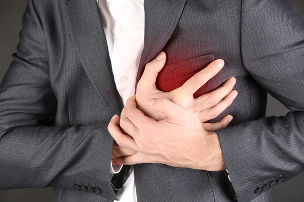 Man having chest pain — Stock Photo, Image