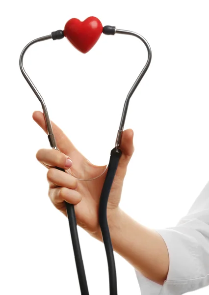 Estetoscópio com coração nas mãos do médico — Fotografia de Stock