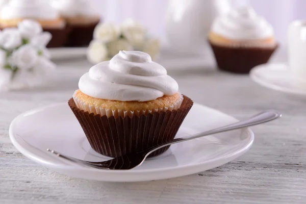 Delicious cupcakes on table — Stock Photo, Image