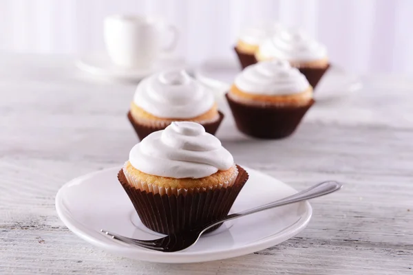 Delicious cupcakes on table — Stock Photo, Image
