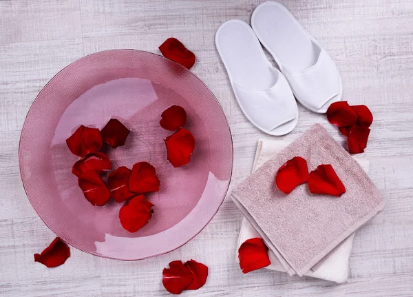 Spa bowl with water, rose petals — Stock Photo, Image