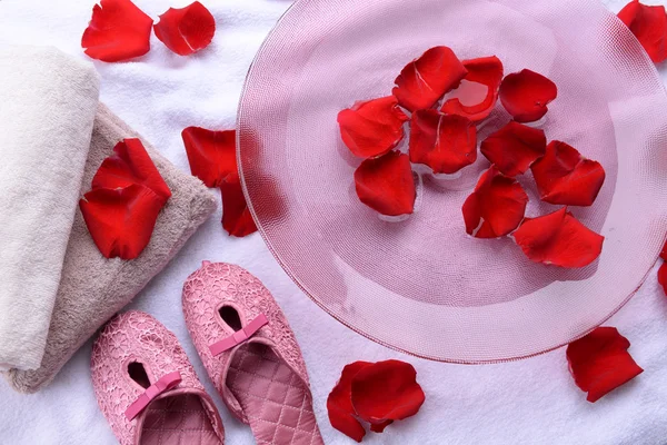 Spa bowl with water, rose petals — Stock Photo, Image