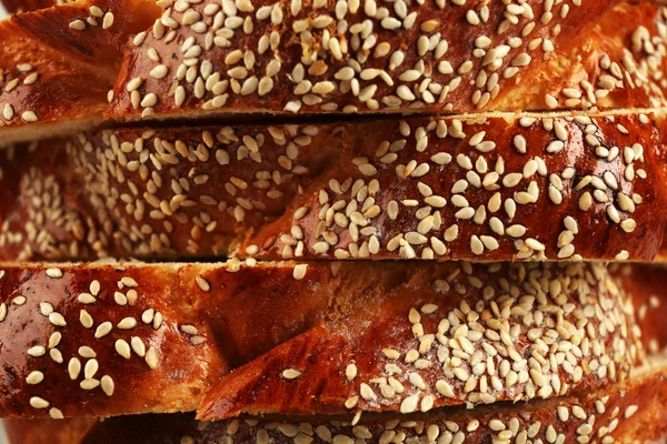 Sliced fresh bun with sesame on close up — Stock Photo, Image