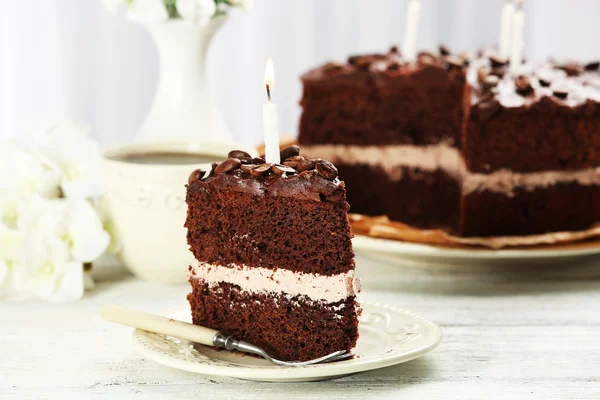 Delicious chocolate cake on table on light background — Stock Photo, Image