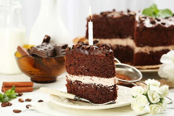 Delicious chocolate cake on table on light background — Stock Photo, Image