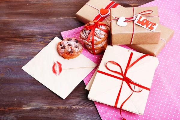 Love letters with coffee and cookies on wooden background — Stock Photo, Image