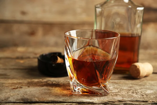 Whiskey on wooden background — Stock Photo, Image
