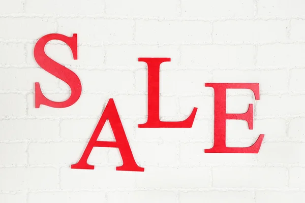 Sale on brick wall background — Stock Photo, Image