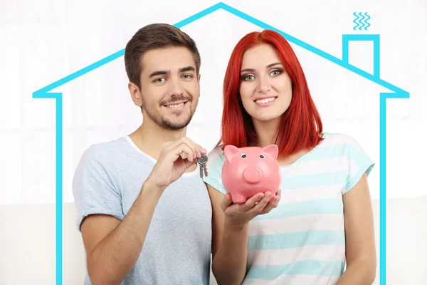 夫婦の貯金と家の図面でキーを愛する — ストック写真