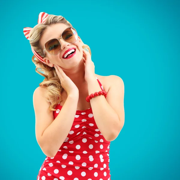 Beautiful girl with pretty smile in pinup style on blue background — Stock Photo, Image