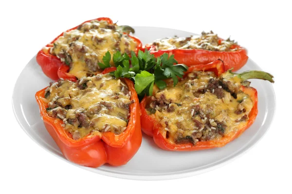 Stuffed red peppers on plate isolated on white — Stock Photo, Image