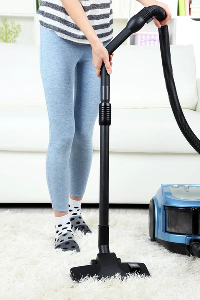 Girl vacuuming in room — Stock Photo, Image