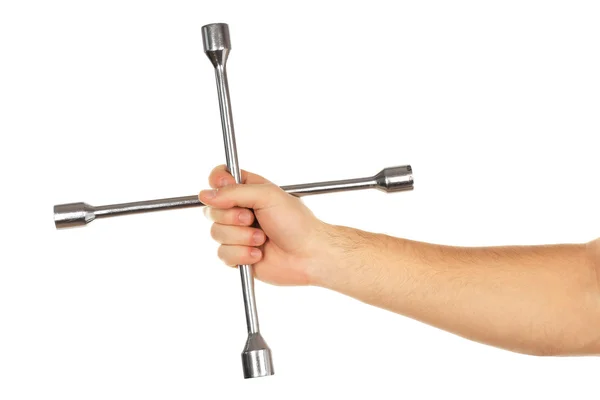 Cross skiftnyckel i manlig hand isolerad på vit — Stockfoto