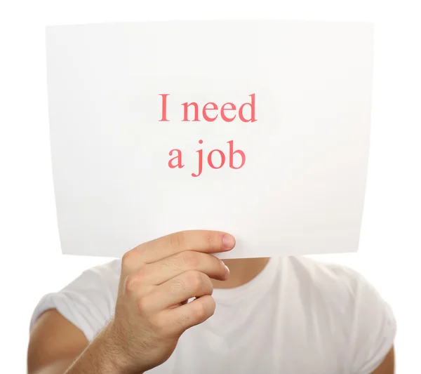 Arkusz papieru z napisem Potrzebuję pracy w męskiej ręce odizolowany na białym — Zdjęcie stockowe
