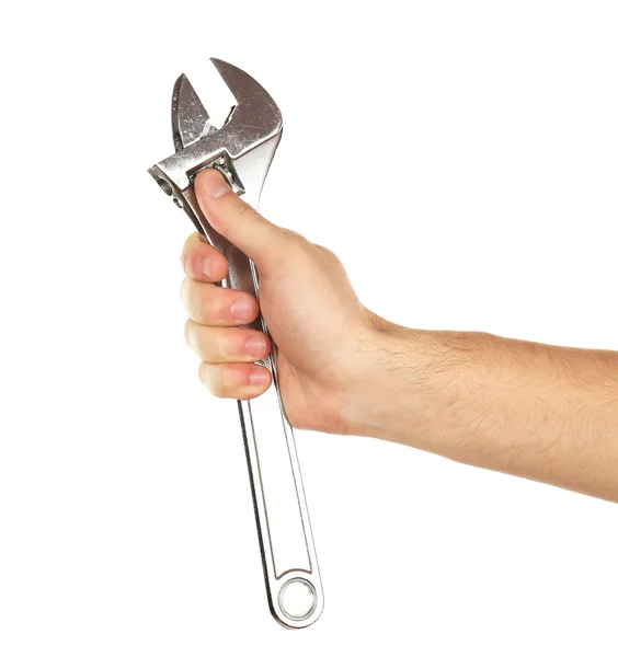 Verstelbare sleutel in mannenhand geïsoleerd op wit Rechtenvrije Stockfoto's