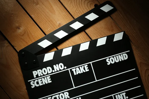 Movie clapper on wooden background — Stock Photo, Image