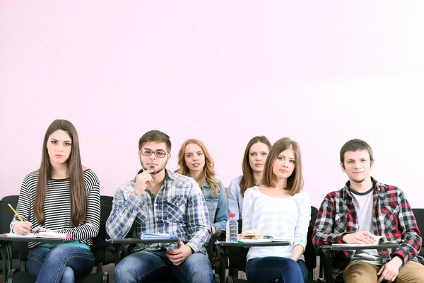 Group of students sitting in classroom — Stock Photo, Image